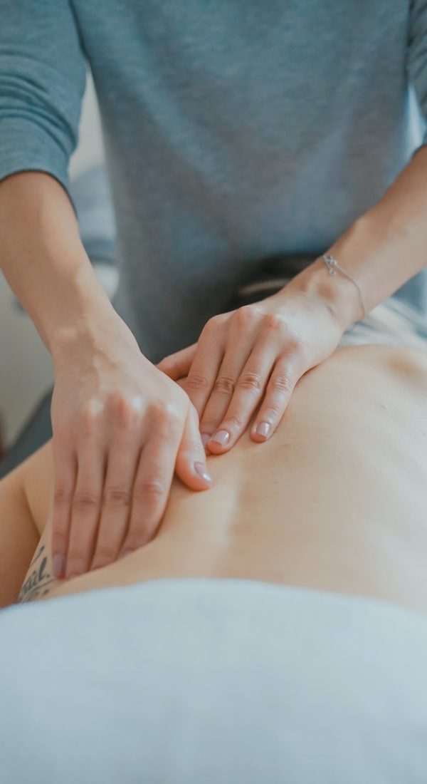 man massaging woman's body